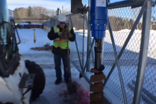 Auger Torque tears through asphalt, frozen ground