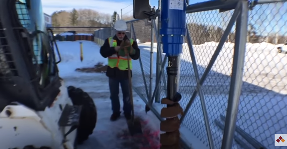 Auger Torque tears through asphalt, frozen ground