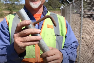 How to use fence hangers to hold up chain link before tying