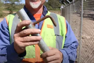 How to use fence hangers to hold up chain link before tying