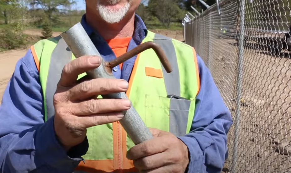 How to use fence hangers to hold up chain link before tying