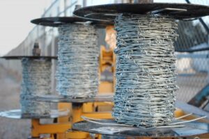 running 3 strands with barbed wire dispenser