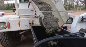 Auger Bucket goes to post holes that other equipment can not