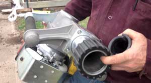 Gas-powered driver pounds fence post for residential chain link project