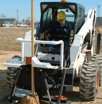 Man installing a fence foundation