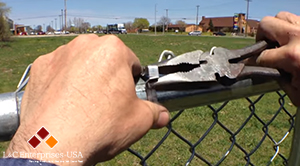 Self-Locking Bands dress up small chain link fence job