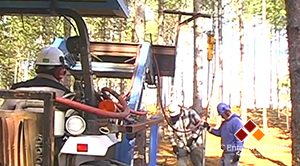 Using a Compressor, Post-Driver and Tractor to Pound Posts in the Woods.