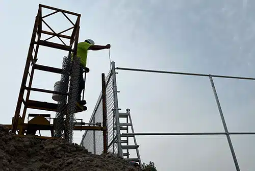 Installink Fence Dispenser in use on job site